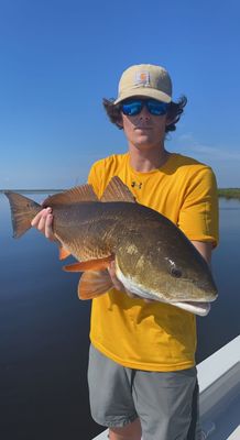 Houma native Roth John poses with a Bull Red