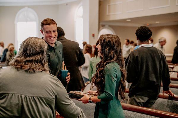 Talking after a service.