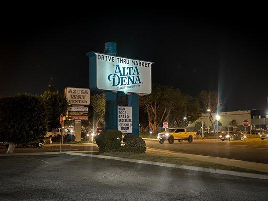 Outside. Picture of business sign from the store parking.