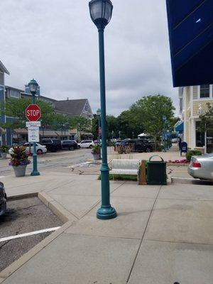 Benches, trash bins and decorative lamp posts throughout the shopping area.