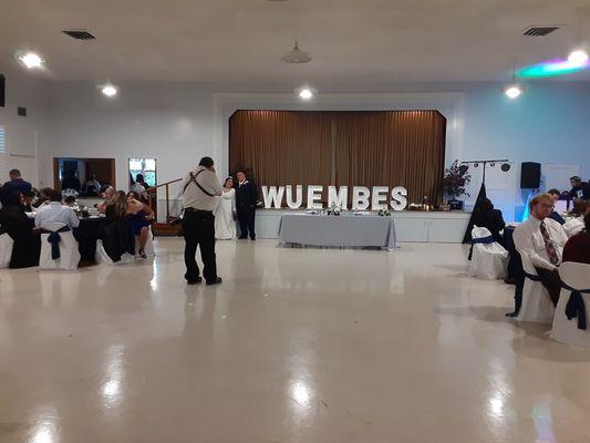 Transition after ceremony, removed chairs and arch added head table and made room for dance floor