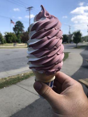 Medium black raspberry/vanilla twist custard cone.