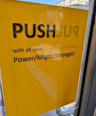 Push the door with "all your Power/Might/Strength"! Hahaha They're not kidding!