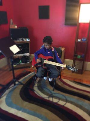 This is Jariel, who is excited to be starting guitar at age 6!