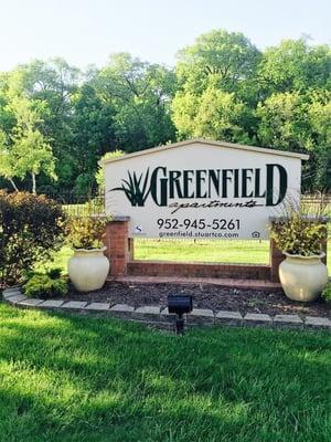 The name of the apartment complex. Turn left by this sign when dropping of your dog.