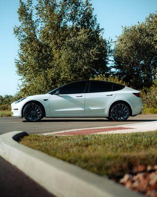 Tesla Model 3 with Vinyl, Paint Protection Film, Ceramic Coating, and Window Tint services.