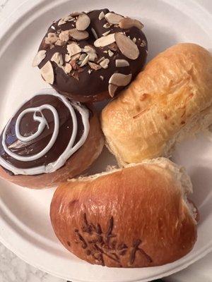 Boston cream, chocolate/almond donut, and sausage and cheese kolaches