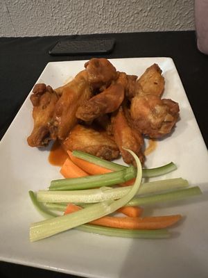 Buffalo hot wings. Not all that crispy but decent and served with ample blue cheese dressing.