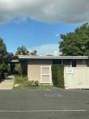 Parking in back, entrance down the walkway