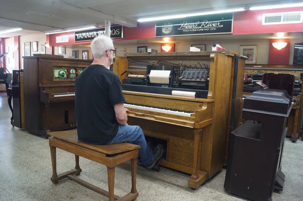 Mr. Neuhaus demonstrates a 1920 player piano.