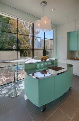 Sculpturally formed island is the centerpiece in this very modern, original San Francisco kitchen.