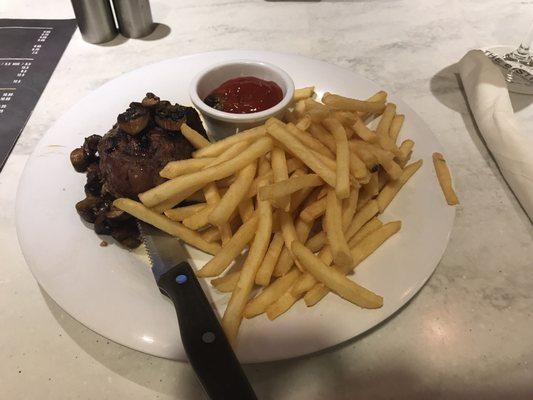 Grilled filet mignon with crisp fries and garlic mushrooms