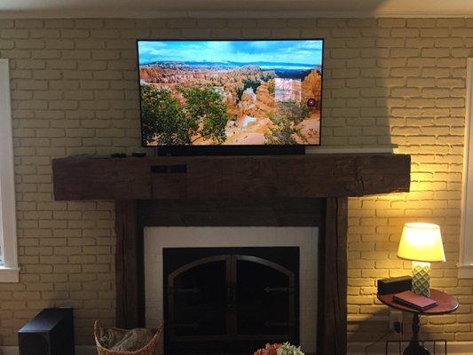 TV install over fireplace with a full brick wall.  Excellent job Hometronics!