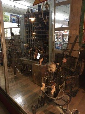 Display of "found object" robots in the front window!