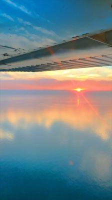 Why learn to become a pilot at Tulip City? Lake Michigan sunsets look the best from the sky