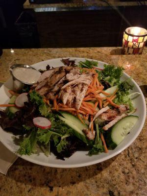 A fresh salad at chicken breast that had a pretty large serving of salad!