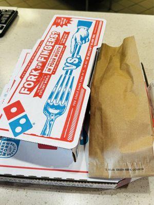 Pizza and breadsticks, they even put the sauce in a nice papers bag!