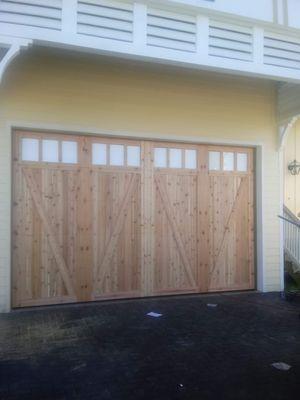 16'X8' wood door with ranch windows.