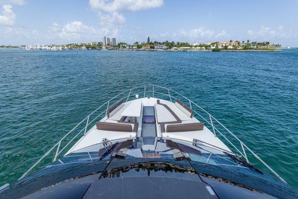 Bow Sunpad of 64ft Galeon soak up the sun