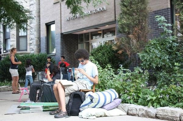 Parents and friends waiting outside four days before the People's Music School's annual registration (first come, first serve)