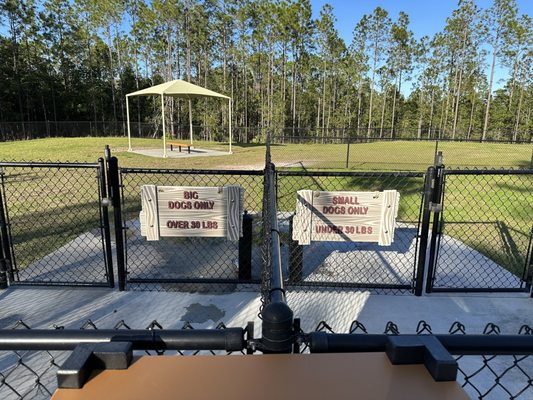 Dog park divided by big dogs (over 30 pounds) and small dogs (under 30 pounds).