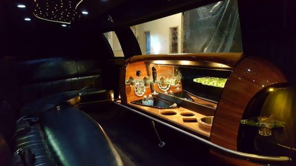 Interior photo of our Lincoln Town Car limousine with 5th door. (Black, seats up to 10) *Ideal for 8 passengers or less*