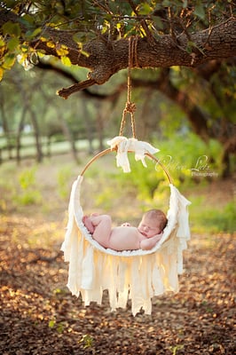 hanging newborn photos, hammock.  always taken as a composite shot with someone's hands on baby at all times