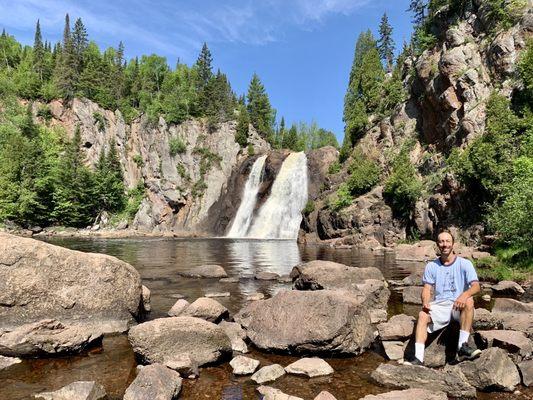 Grabbing a seat on the rocks for a photo with High Falls in the background. Overall, it's scenic here.