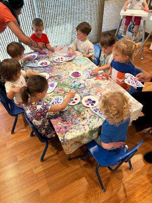 Tiny artists at work! Our kids enjoy finger painting hearts, expressing their creativity and love at Play Ranch Family Child Care.