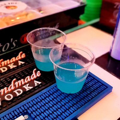 Blue Gatorade Shots - Blueberry Smirnoff vodka, splashes of lemonade and Blue Curacao.