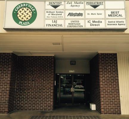 Outdoor signage and entrance to the building. 11710 Reisterstown Road, Suite 201.