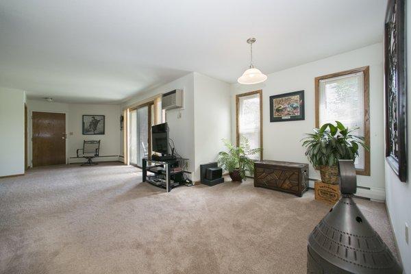 Large dining room looking toward the patio doors.