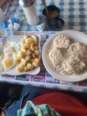 Biscuits with sausage gravy, eggs, and homefries