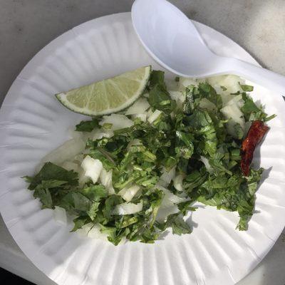 Onions, cilantro, and lime you get for yourself on side