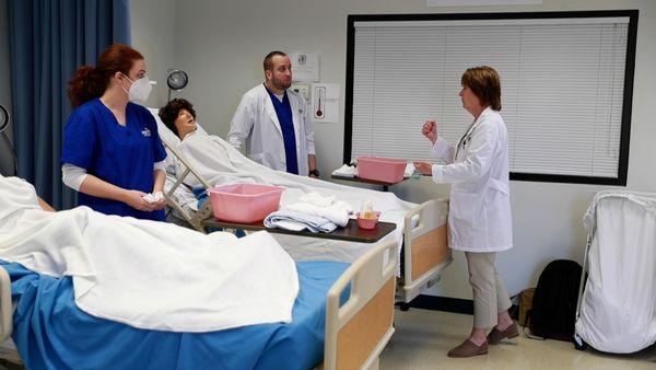 Nursing students listening to an instuctor