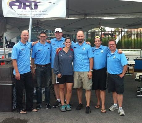 Treating athletes at the Active Release Techniques tent at the REV3 triathlon at Cedar Point.