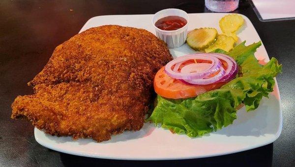 Hand pounded pork tenderloin, breaded in the kitchen. Crispy crust, tender on the inside, not too thin - It was fantastic!