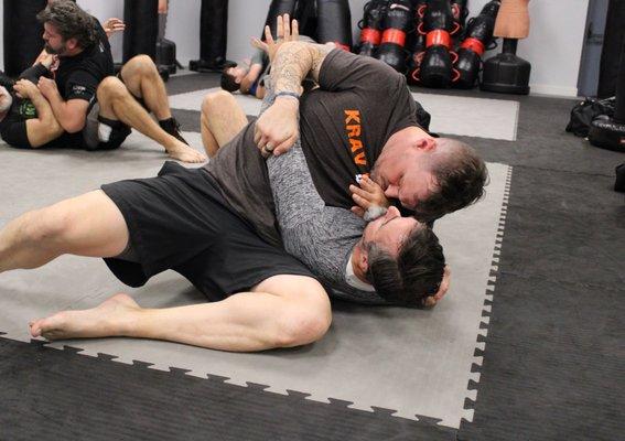 Students during an optional ground sparring session.