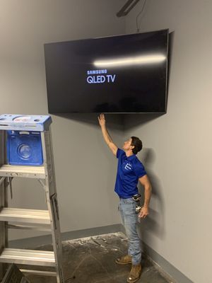 85 inch Samsung QLED TV on a corner articulating wall mount