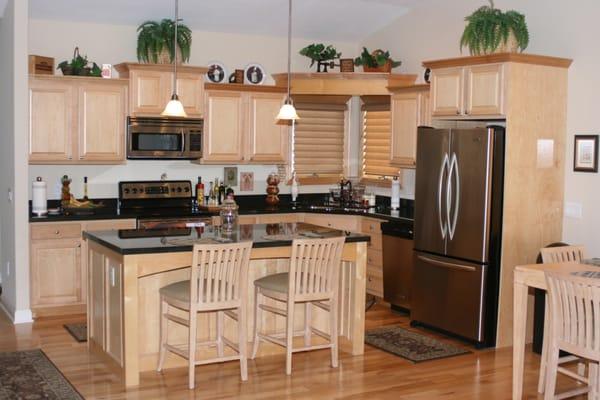 Open design maple raised panel kitchen with spacious island.