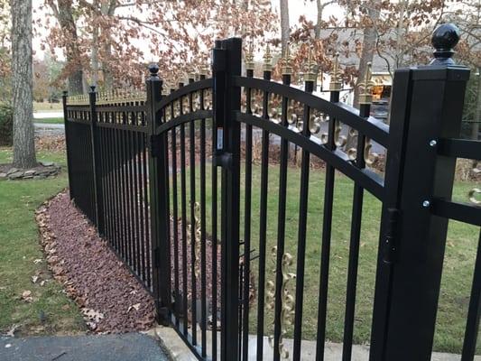 Commercial black aluminum fence including gold colored fleur-de-Lis finials and butterfly scrolls. Another happy customer in New Egypt.