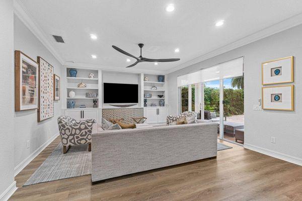 Light fixture, crown molding, paint, vinyl floors and built ins.