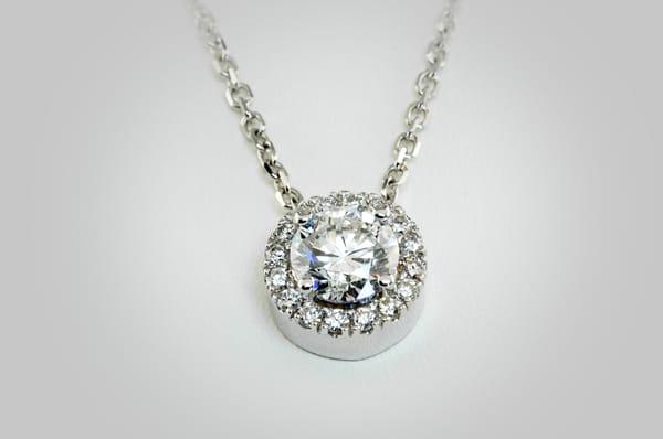 Halo Pendant .070 brilliant 14 KT white gold center stone.