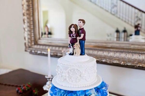 Our cake topper (we provided) but you can see the beautiful cake.