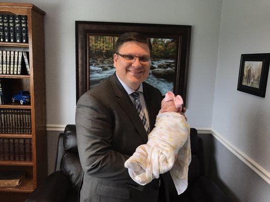 Pastor Evertson welcoming a new baby!