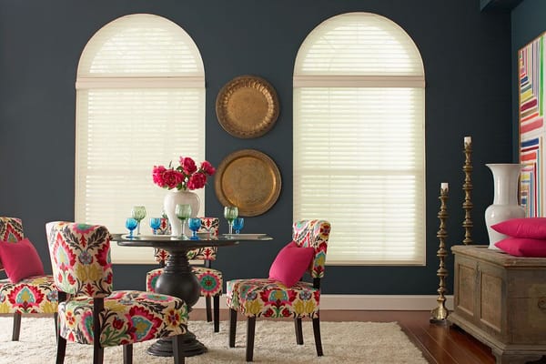 Highlight arched windows with custom sheer shades.