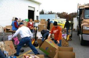 Medical Missionaries volunteers loading sea containers of supplies to be sent to those in need throughout the world