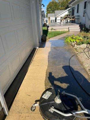 Cleaning a dirty driveway and sidewalk with our biodegradable cleaning solution and our commercial grade surface cleaners