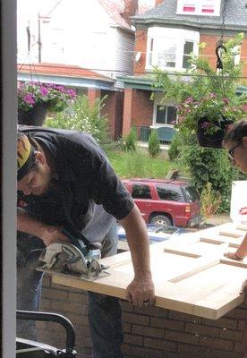 Jody cutting down back door to fit