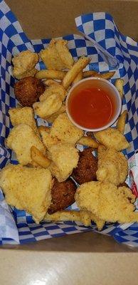 Fried catfish, clearly homemade hushpuppies, and fries.